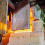 Close-up view of a working glass furnace in an industrial setting, showcasing high-temperature operations. - Photo by Keegan Checks on Pexels
