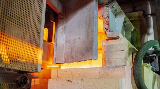 Close-up view of a working glass furnace in an industrial setting, showcasing high-temperature operations. - Photo by Keegan Checks on Pexels